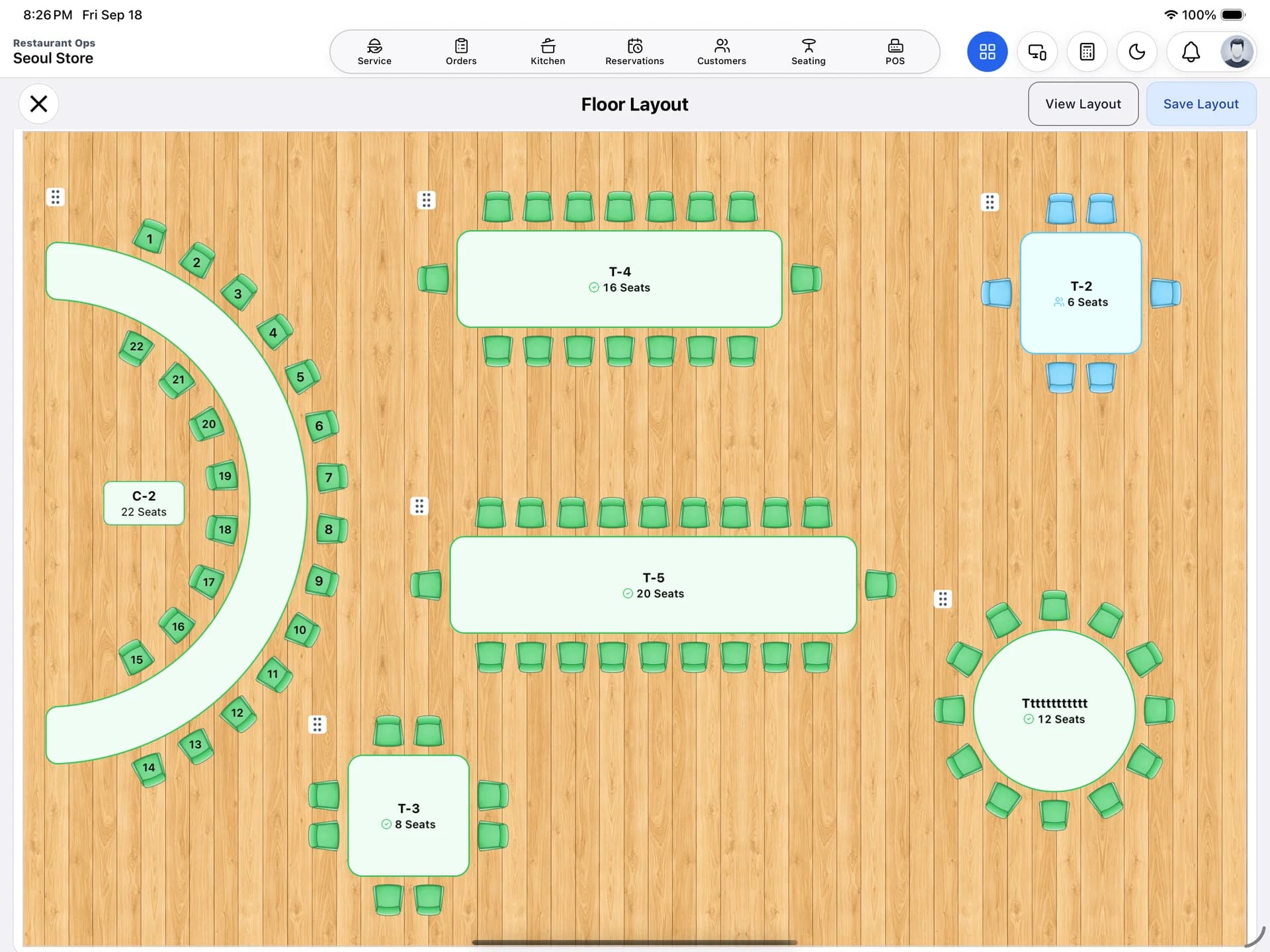 Floor Layout editor showing placed rectangular and round tables and a curved counter.
